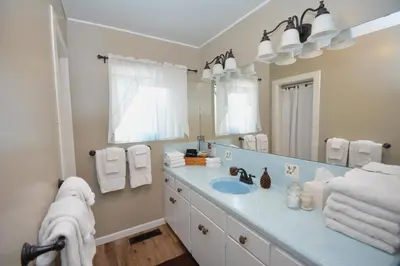 a bathroom with a sink and a mirror at Fox Lake View in Bass Lake