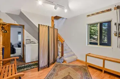 a living room with a staircase and a living room with a stair at Incline Village Getaway in Incline Village