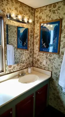 a bathroom with a sink and a mirror at Mystic Mountain Retreat in Miramonte
