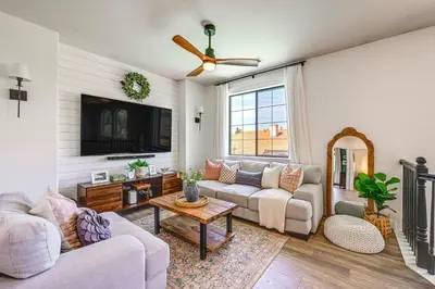 a living room with two couches and a tv at Enchanting Clovis Haven with Hot Tub and Private Pool! in Clovis