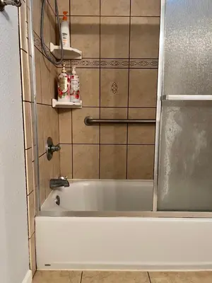 a shower with a bath tub in a bathroom at Cozy Suite with Private Patio Close to Downtown and UC Davis Medical Center in Sacramento