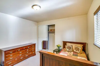 a bedroom with a bed and a dresser at 1 Mi to Ski Resort South Lake Tahoe Townhome in South Lake Tahoe