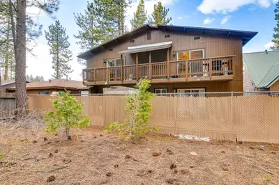 a house with a fence in front of it at 1 Mi to Ski Resort South Lake Tahoe Townhome in South Lake Tahoe