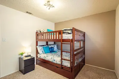 a bedroom with two bunk beds in a room at Royal Arches Cottages in Oakhurst