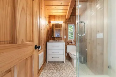 a bathroom with a toilet and a sink and a shower at 3BD Retreat - 5 Min to Beach Trails & Town in Carnelian Bay