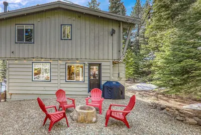 a group of red chairs in front of a house at 3BD Retreat - 5 Min to Beach Trails & Town in Carnelian Bay