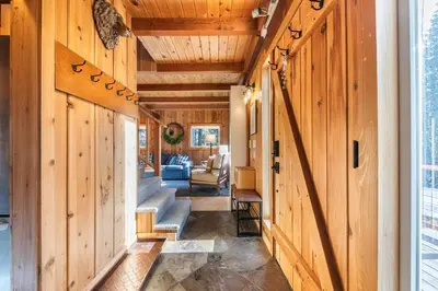 a hallway of a house with wooden walls and stairs at 3BD Retreat - 5 Min to Beach Trails & Town in Carnelian Bay