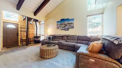 a living room with a couch and a table at Sierra Park Road #150 condo in Mammoth Lakes