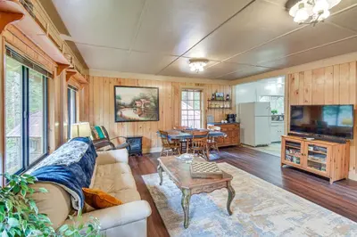 a living room with a couch and a table at 8 Mi to Yosemite National Park Cabin with Fire Pit in Oakhurst