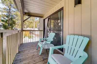 two chairs and a table on a porch at 1 Mi to Lake Tahoe Condo with Pool Access in Kings Beach
