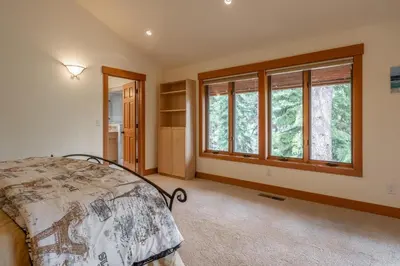 a bedroom with a bed and two windows at Northstar - Northstar Vista in Truckee