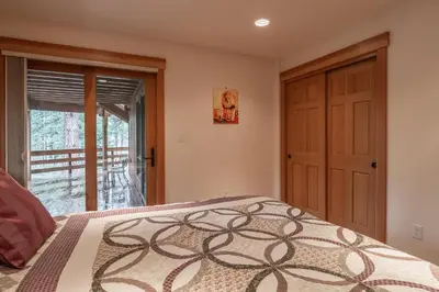 a bedroom with a bed and a sliding glass door at Northstar - Northstar Vista in Truckee