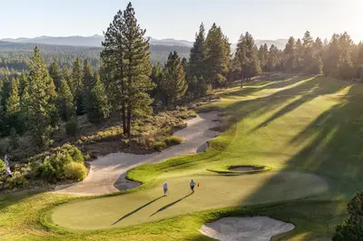 two people playing on a golf course at The Cottages - Ski Shuttle, Ski Valet - 2-Bedroom in Truckee
