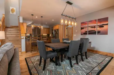 a dining room with a table and chairs at The Cottages - Ski Shuttle, Ski Valet - 3-Bedroom in Truckee