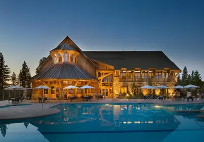 a large building with a pool in front of it at The Cottages - Ski Shuttle, Ski Valet - 3-Bedroom in Truckee