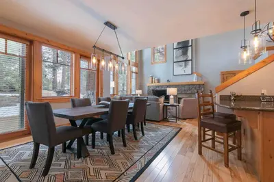 a dining room with a table and chairs at The Cottages - Ski Shuttle, Ski Valet - 3-Bedroom in Truckee