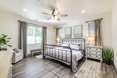 a bedroom with a bed and a ceiling fan at Game Room and Patio Picturesque Home in Sonora in Sonora