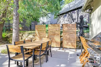 a wooden table and chairs on a patio at Game Room and Patio Picturesque Home in Sonora in Sonora