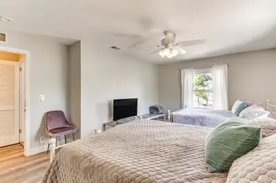 a bedroom with two beds and a ceiling fan at Beautiful Kernville Home with Game Room and Mtn Views! in Kernville