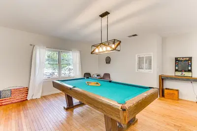 a living room with a pool table in it at Beautiful Kernville Home with Game Room and Mtn Views! in Kernville