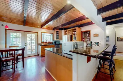 a kitchen with wooden ceilings and a counter top at Mountain Escape in South Lake Tahoe