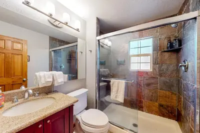 a bathroom with a shower and a toilet and a sink at Mountain Escape in South Lake Tahoe