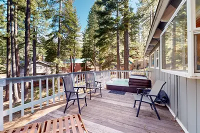 a deck with chairs and a bench on a house at Mountain Escape in South Lake Tahoe