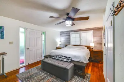 a bedroom with a bed and a ceiling fan at On-Site River Access Quiet Home in Wilseyville! in Wilseyville