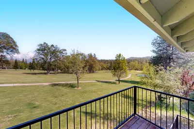 a balcony with a view of a golf course at Fair Days on the Fairway in Groveland