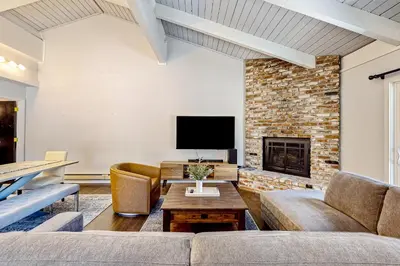 a living room with a couch and a fireplace at Sierra Tranquility in Incline Village