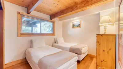 a bedroom with two beds and a window at Lake Beach Access Pool Tennis Walk to Chambers Tahoe Timber by AvantStay in Homewood