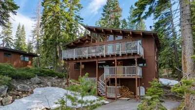 a house in the woods with two decks at Lake Beach Access Pool Tennis Walk to Chambers Tahoe Timber by AvantStay in Homewood