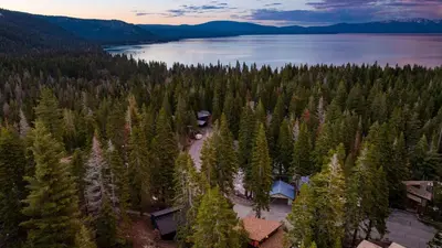 an aerial view of a lake and forest at Lake Beach Access Pool Tennis Walk to Chambers Tahoe Timber by AvantStay in Homewood