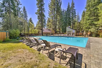 a swimming pool with chaise lounge chairs around it at Steps to Lake Scenic Carnelian Bay Retreat in Carnelian Bay