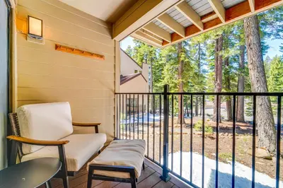 a screened porch with a chair and a window at Steps to Lake Scenic Carnelian Bay Retreat in Carnelian Bay