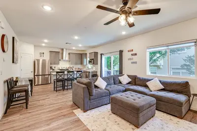 a living room with a couch and a ceiling fan at Spacious Family Home in Stockton - Pets Welcome! in Stockton