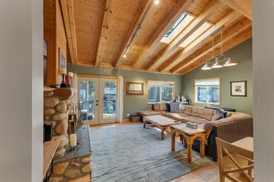 a living room with a couch and a table at 3BR with Hot Tub 1 Mile to Diamond Peak in Incline Village