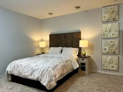 a bedroom with a large bed with two lamps at Spacious 2Beds Suite Close to Downtown and UC Davis Medical Center in Sacramento