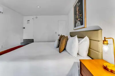a bedroom with a large white bed with white pillows at Luxurious 7BR Walk 2 Beach and Bus Stop in Carnelian Bay