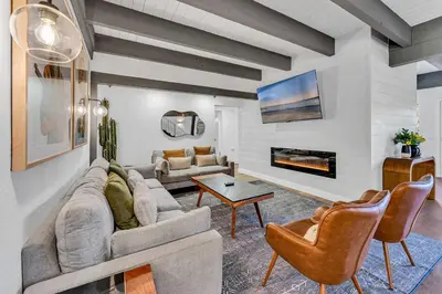 a living room with a couch and a fireplace at Luxurious 7BR Walk 2 Beach and Bus Stop in Carnelian Bay