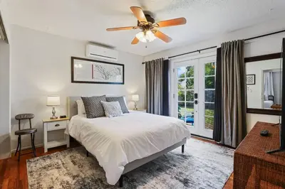 a bedroom with a bed and a ceiling fan at Trinity Escape Entire home near Lodi Lake in Lodi