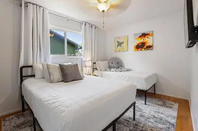 a bedroom with two beds and a window at Trinity Escape Entire home near Lodi Lake in Lodi