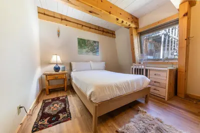 a bedroom with a bed and a window and a sink at 4BD with Lake Views Near Beach and Slopes in Tahoe City