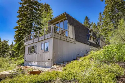 a house on top of a hill with trees at 4BD with Lake Views Near Beach and Slopes in Tahoe City