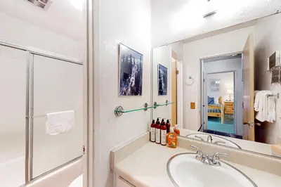 a bathroom with a sink and a shower at Bigwood 54 K in Mammoth Lakes