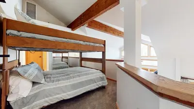 a bedroom with two bunk beds in a room at Snowcreek V #874 condo in Mammoth Lakes