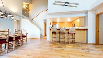 a kitchen and dining room with a table and chairs at Snowcreek V #874 condo in Mammoth Lakes