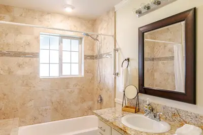 a bathroom with a tub and a sink and a mirror at Willow Nest - Sequoia And Kings Canyon Villa - Luxury In Nature in Hoffman Point