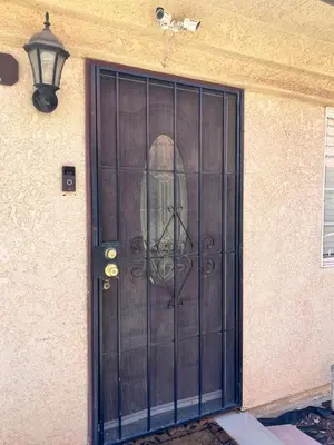 a door with a face in the middle of it at Serene 2bed 1bath condo with parking in Fresno