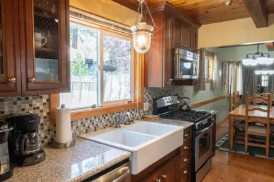 a kitchen with a sink and a stove at Fern Grove - Hot Tub, Pet Friendly, Walk to Lake! in Tahoe City